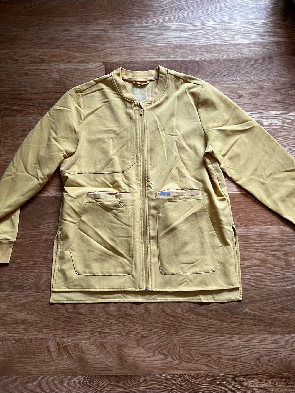 Figs Women's Bellery Scrub Jacket in Light Gold
